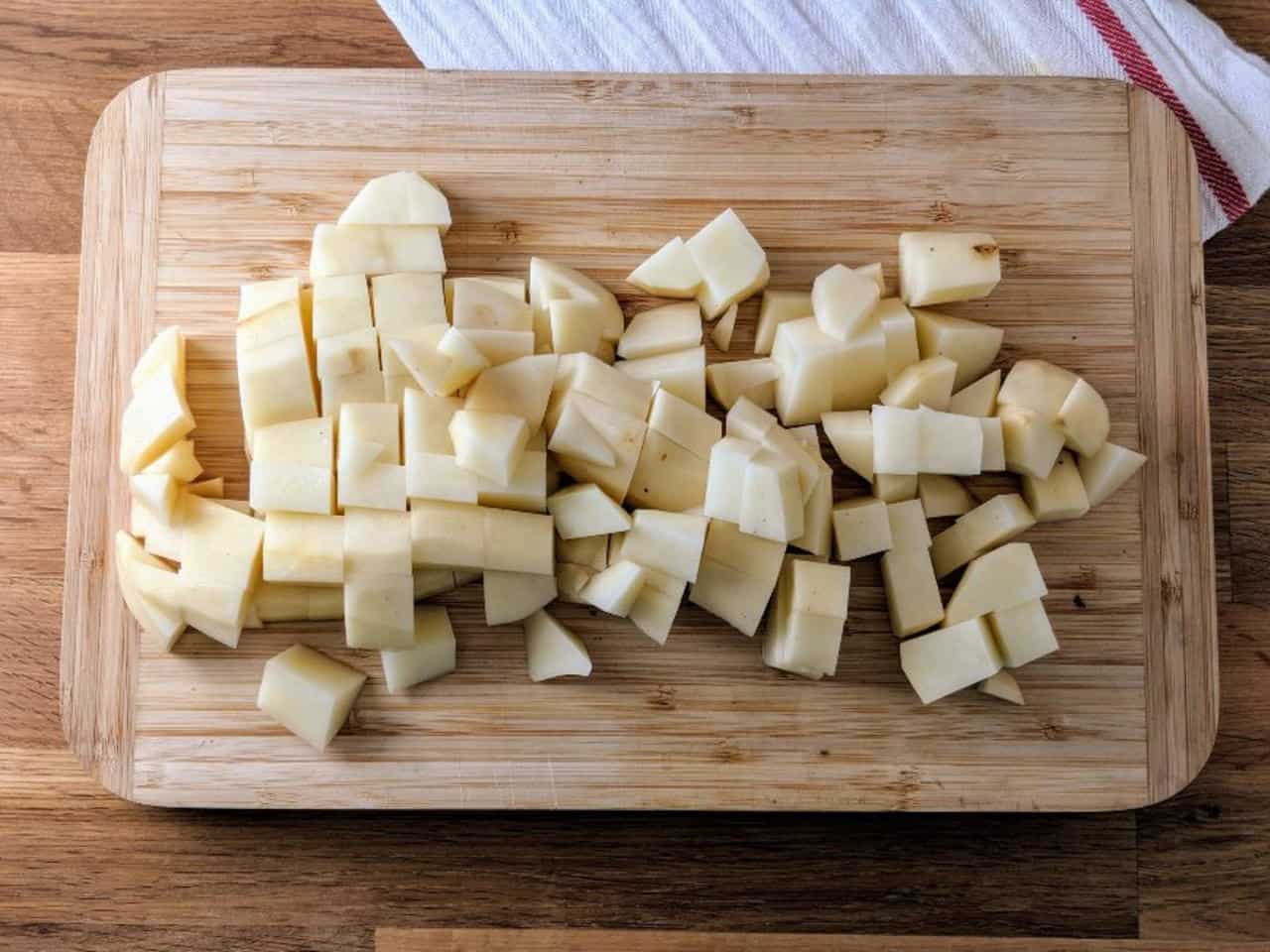 Preparing raw potatoes for chicken feeding